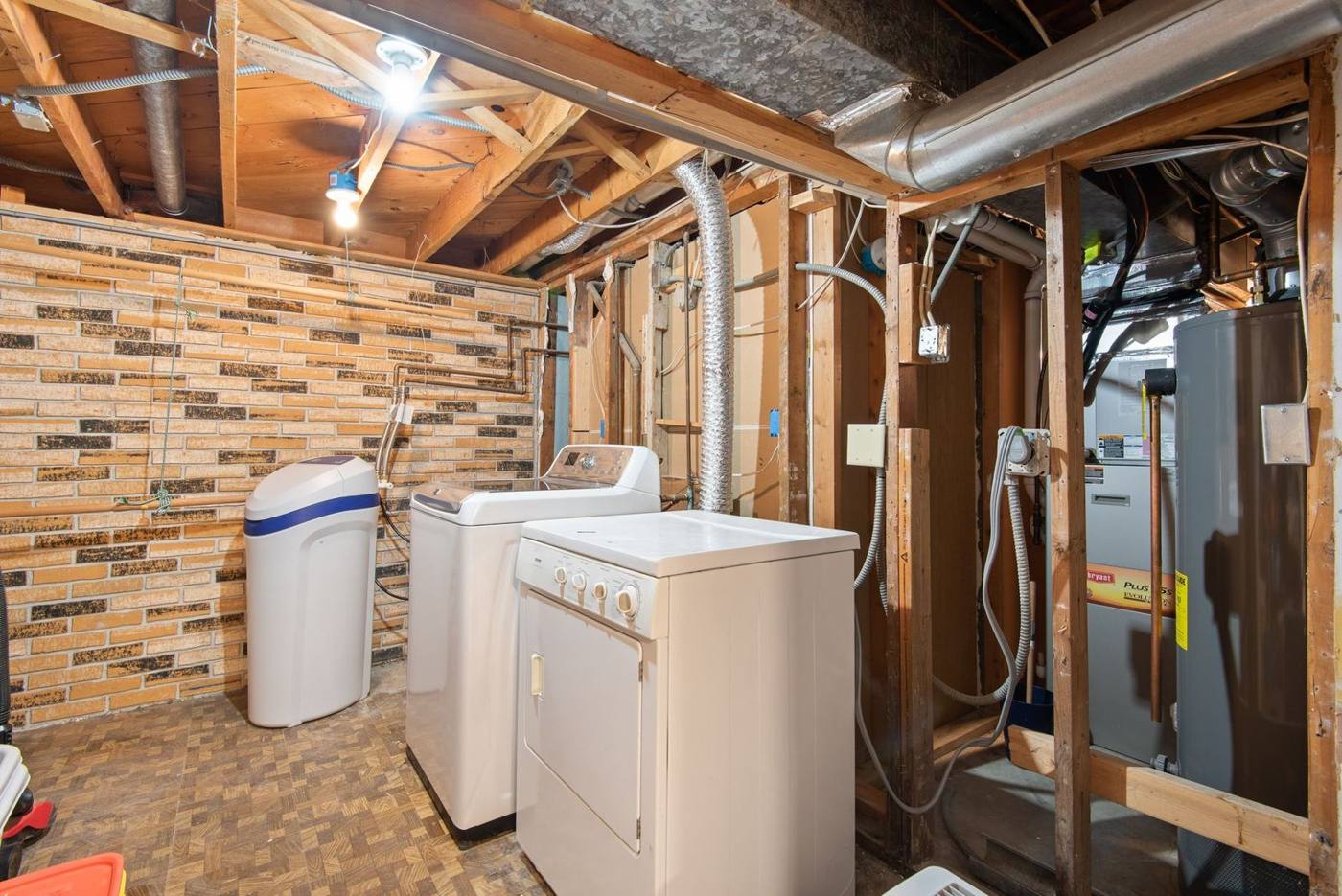 Basement utility area with a furnace and water heater