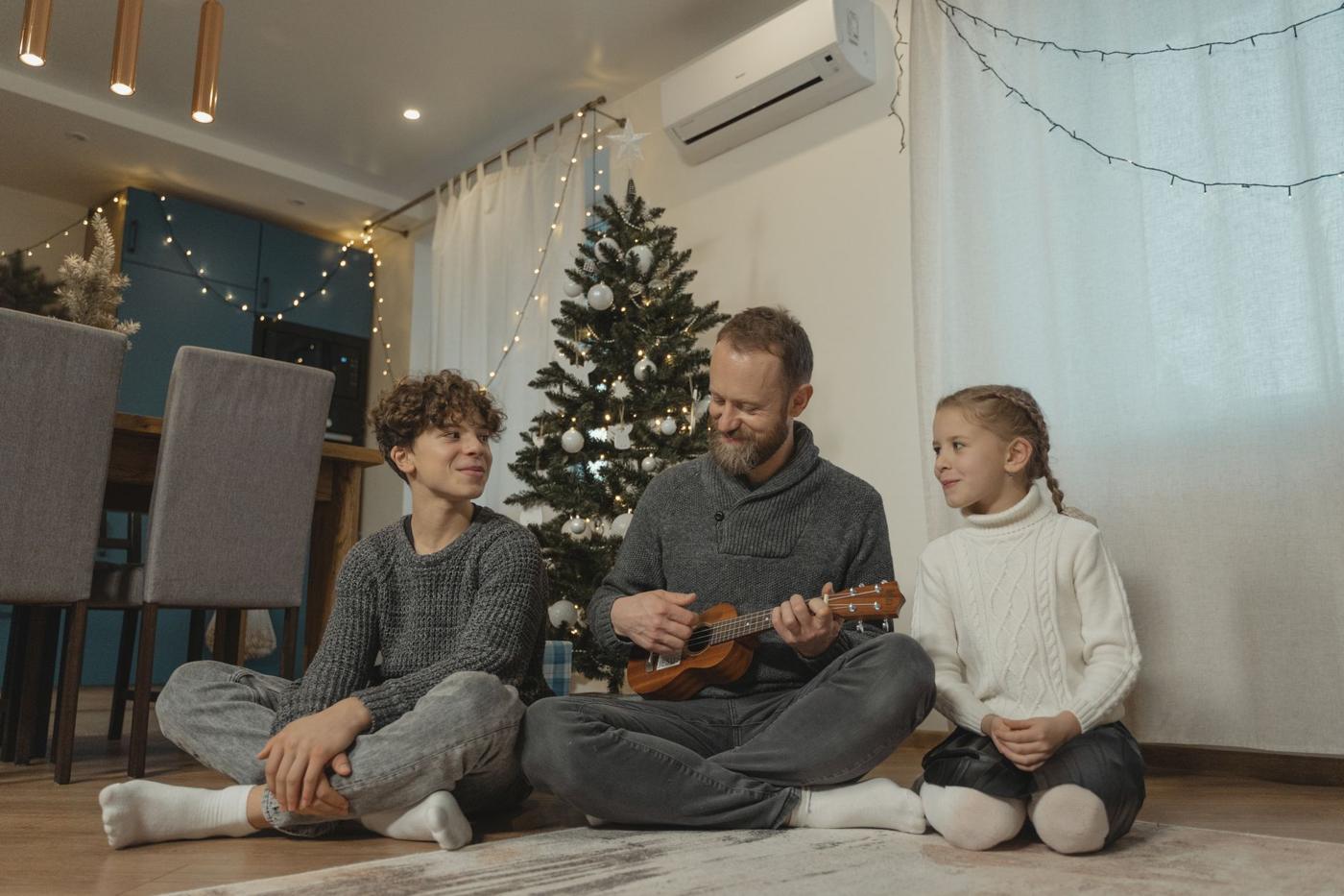 Family relaxing together in a warm living room in winter