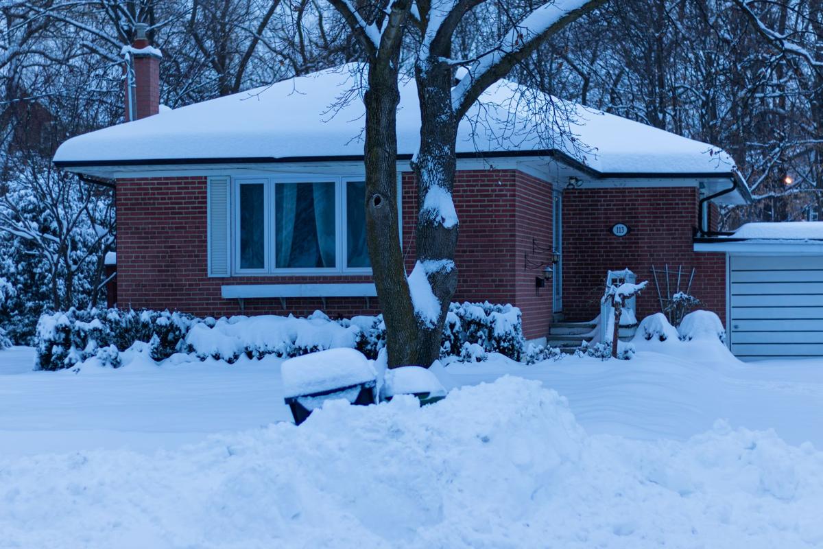 Snow-covered house on a cold winter day