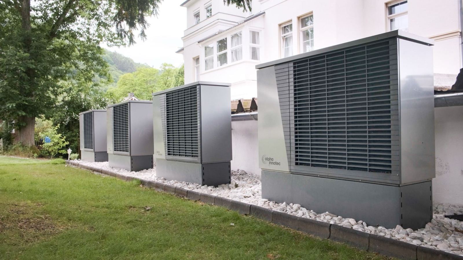 Outdoor heat pump units beside a home