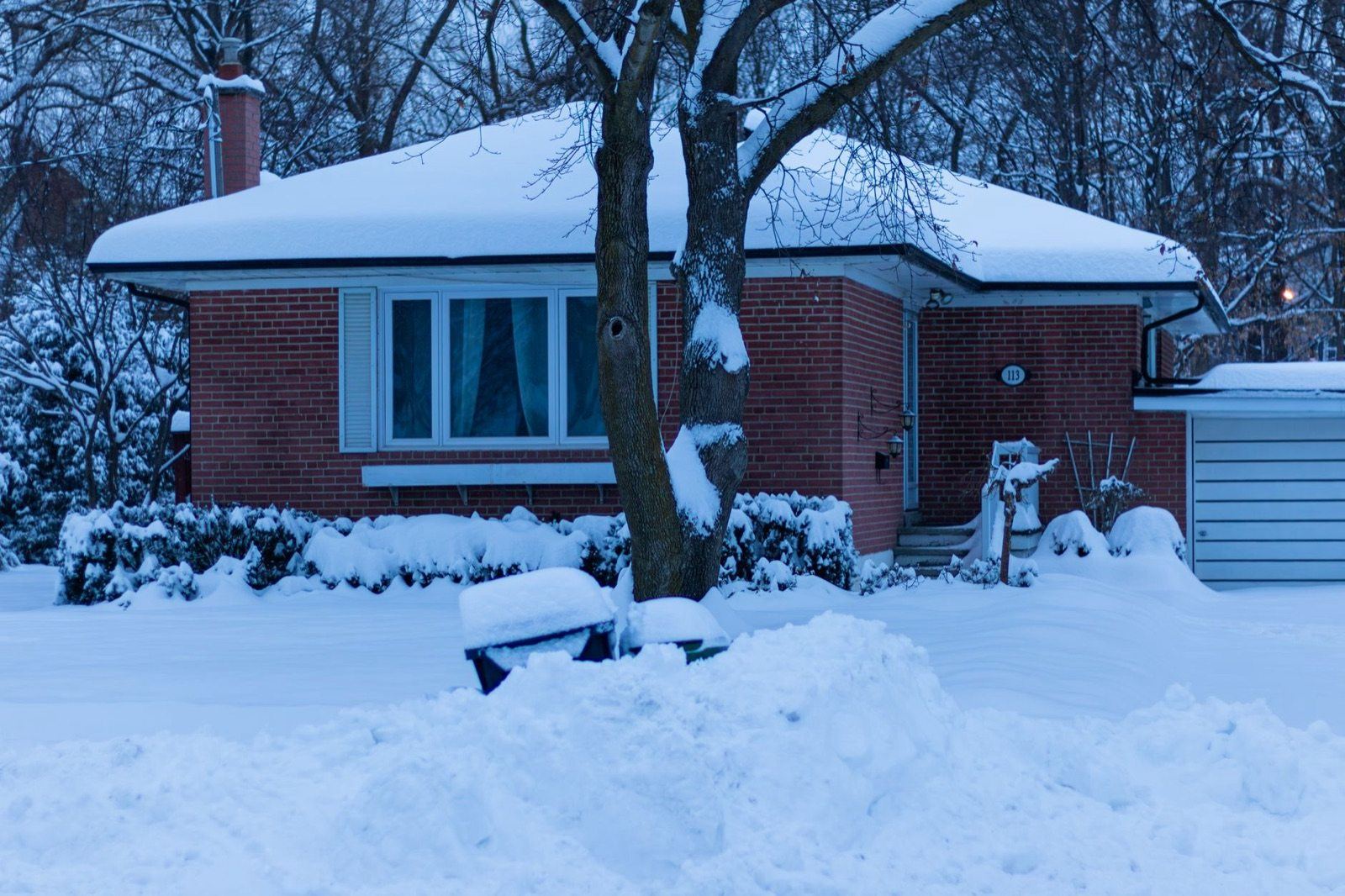 Snow around a house in winter